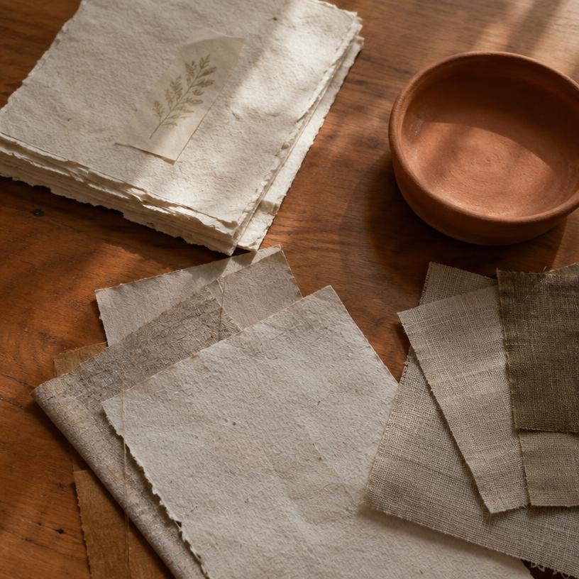Paper, fabric and clay samples on the Studio Marrow worktable